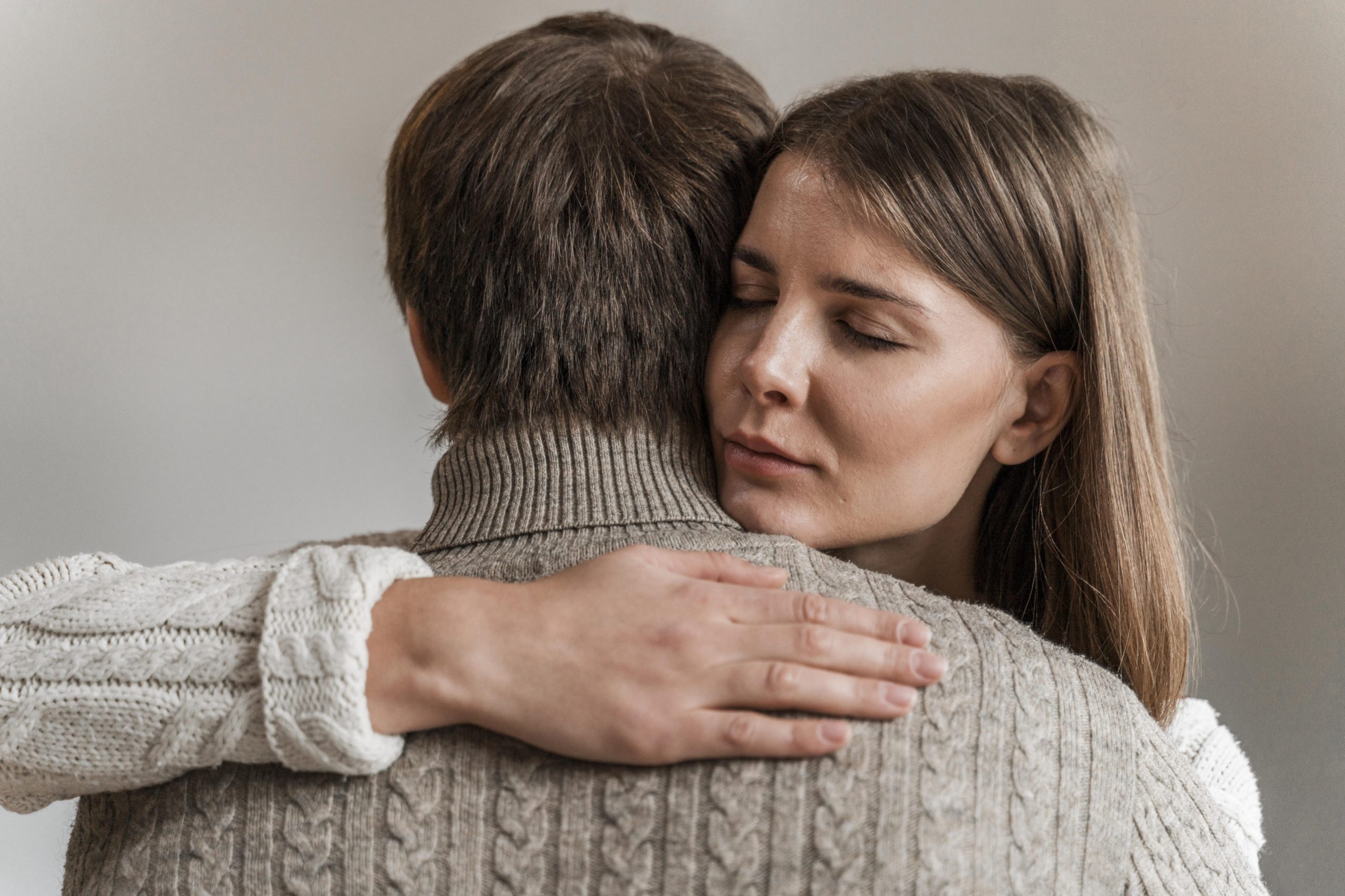 adult-woman-hugging-her-husband